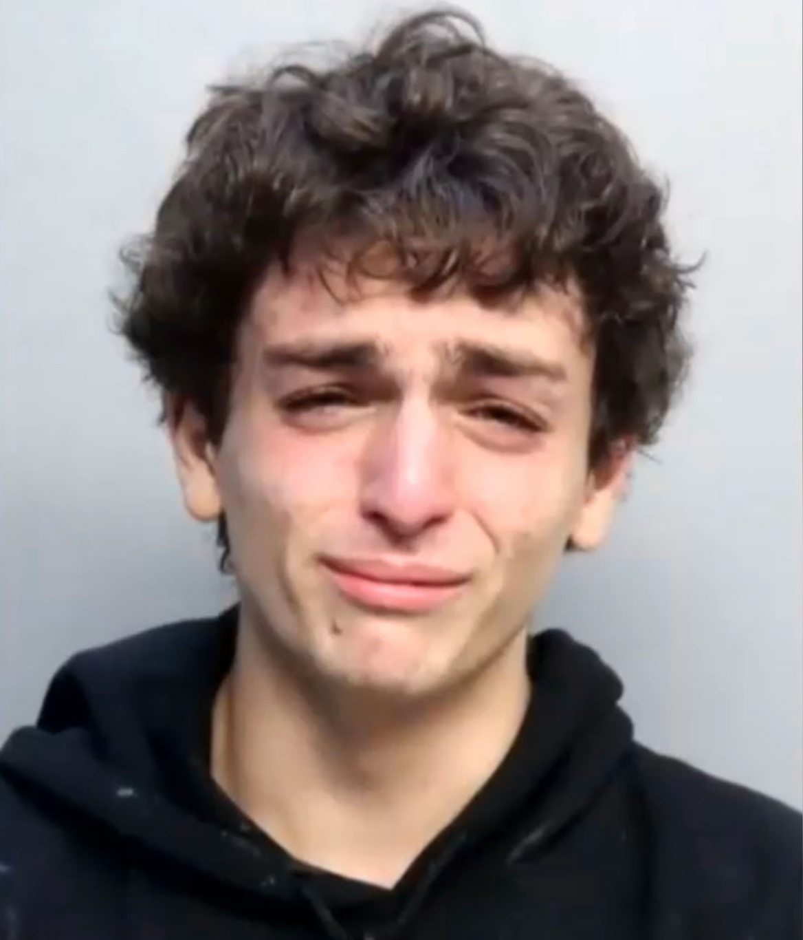 Avraham Gil was captured crying during his mug shot after he was arrested for intentionally driving into a police lieutenant on Jan. 27. Local 10
